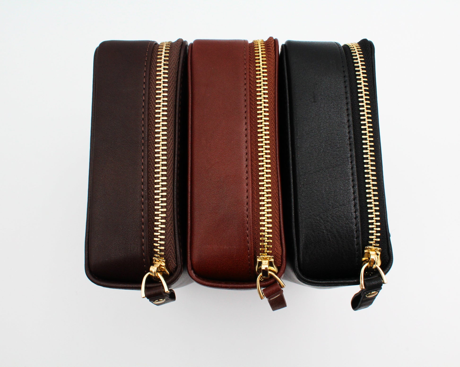 Pictured left to right: Burgundy Leather Portfolio, Cognac Leather Portfolio, Ebony Leather Portfolio